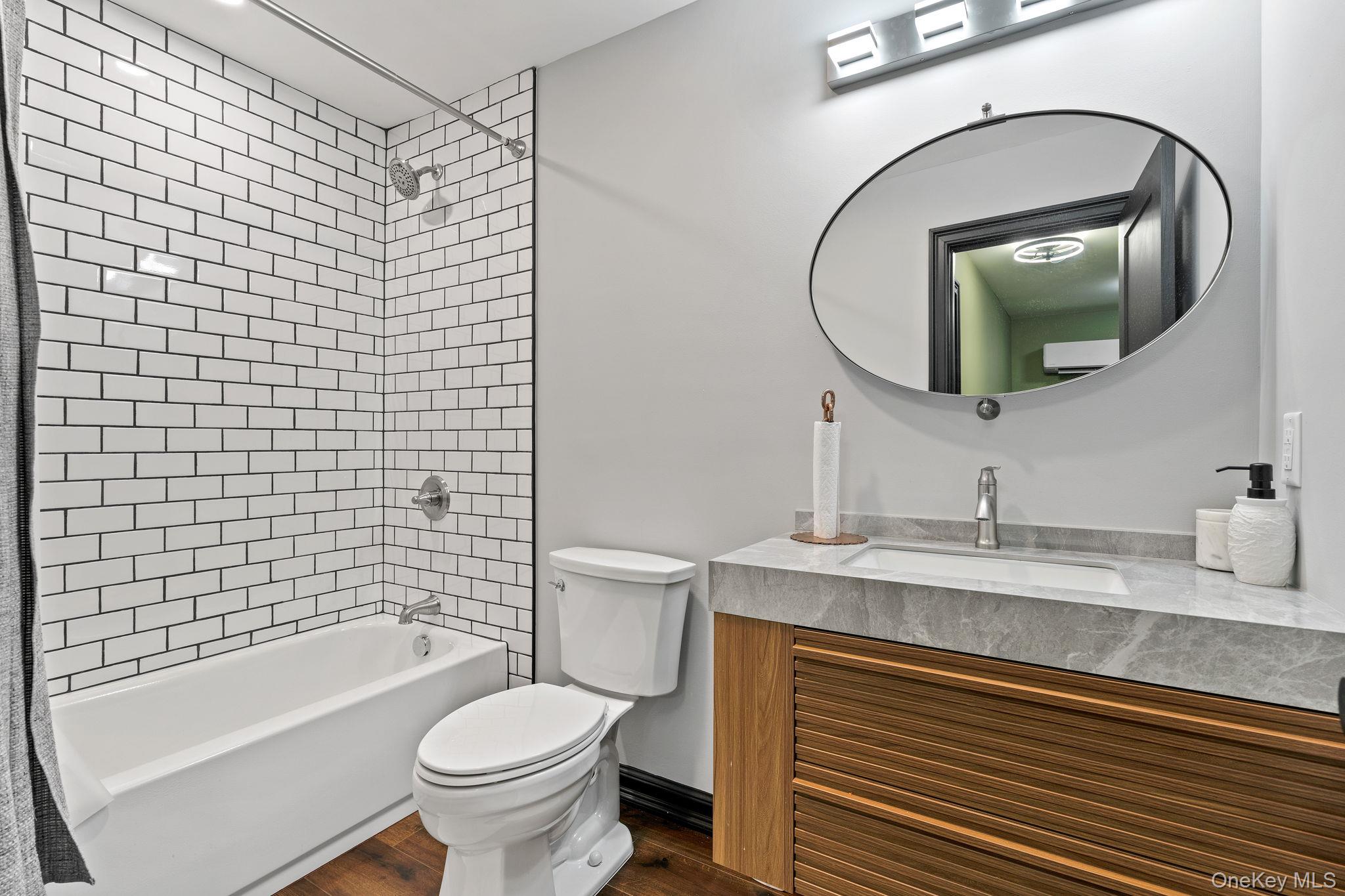 660 South Plank Road Newburgh, NY 12550 - Photo 26 of 50 a bathroom with a sink a toilet and a mirror