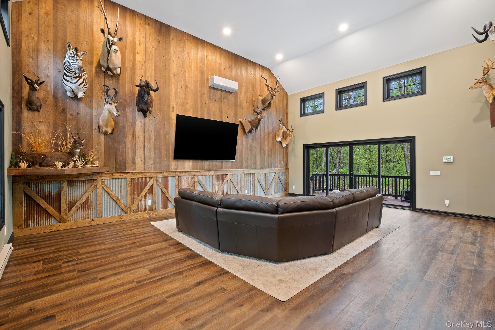 660 South Plank Road Newburgh, NY 12550 - Photo 9 of 50 a living room with furniture and a flat screen tv