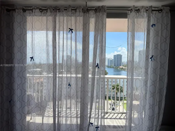 a bathroom with a glass shower door and a sink