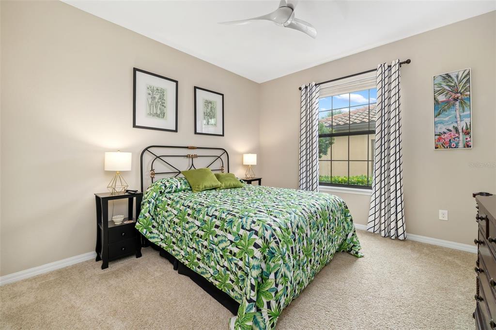 13725 Messina Loop, Unit 104 Bradenton, FL 34211 - Photo 20 of 77 a bedroom with a bed and a window