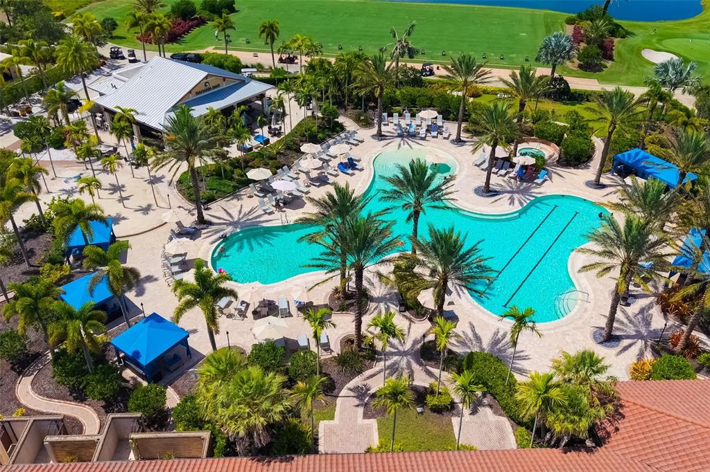 13725 Messina Loop, Unit 104 Bradenton, FL 34211 - Photo 56 of 77 an aerial view of swimming pool patio and outdoor seating