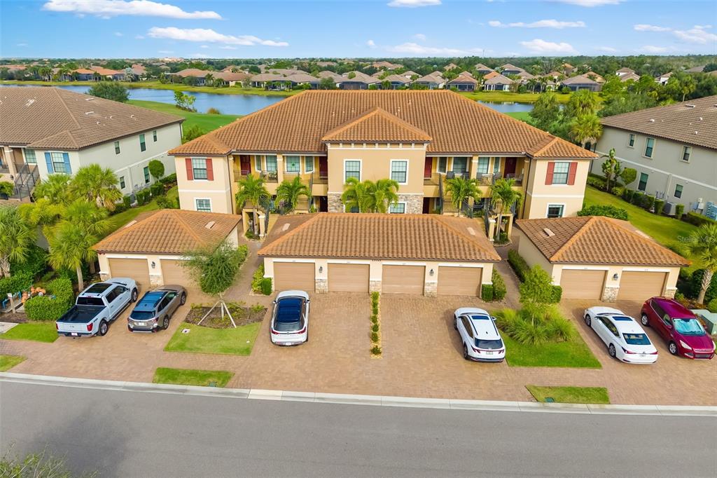 13725 Messina Loop, Unit 104 Bradenton, FL 34211 - Photo 66 of 77 an aerial view of a house with garden space and street view