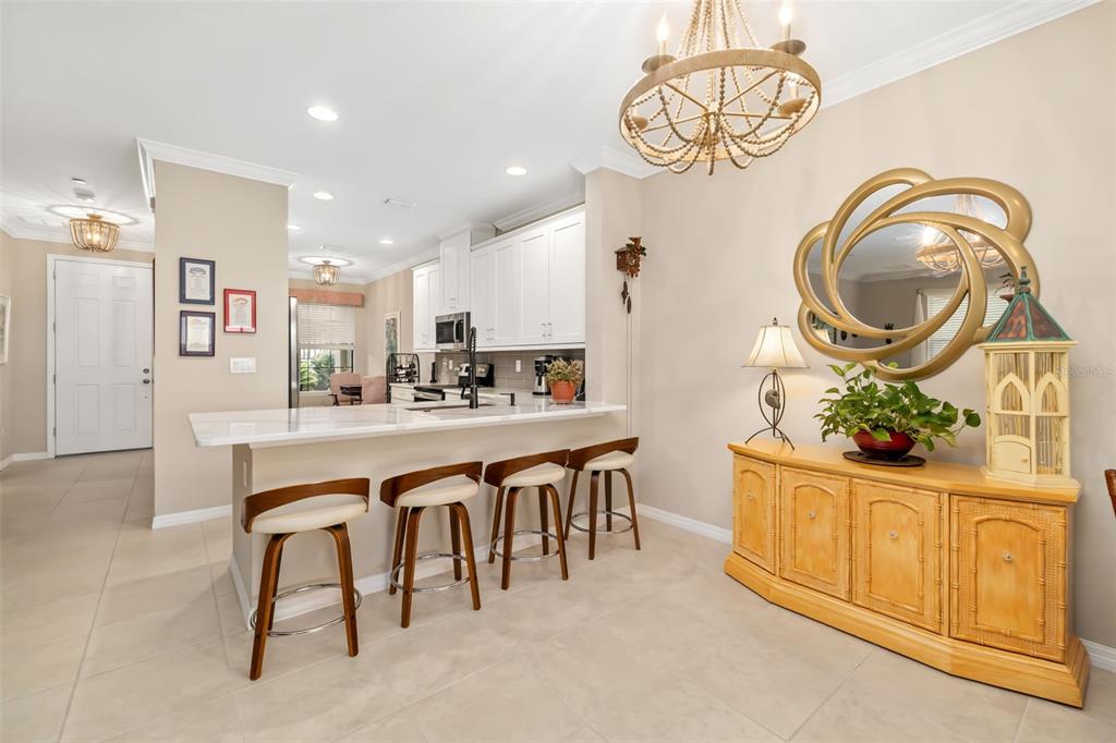 13725 Messina Loop, Unit 104 Bradenton, FL 34211 - Photo 7 of 77 a dining hall with stainless steel appliances granite countertop a stove and a wooden floors