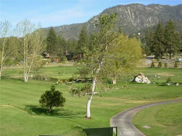 a view of a golf course with an trees