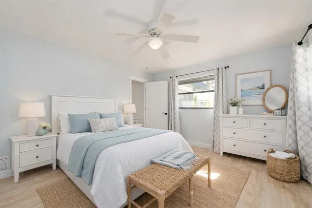 a bedroom with a bed and a dresser