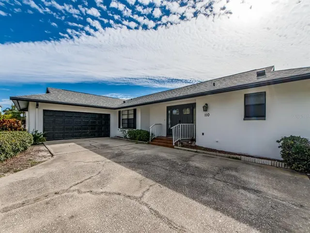 a house with yard and a parking space