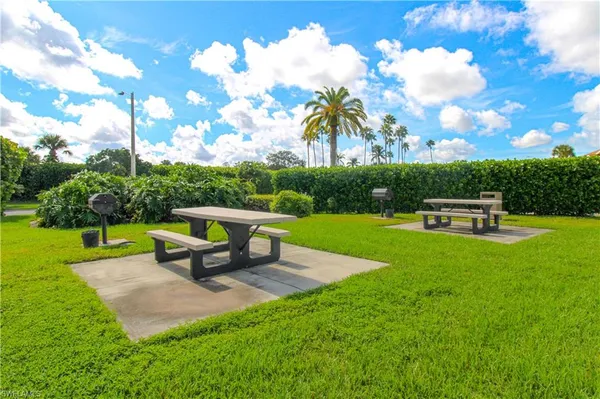 a park view with a bench in garden
