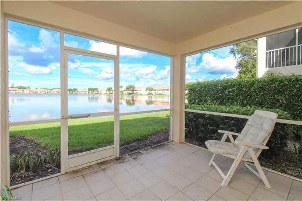 a view of a chair and table in the porch
