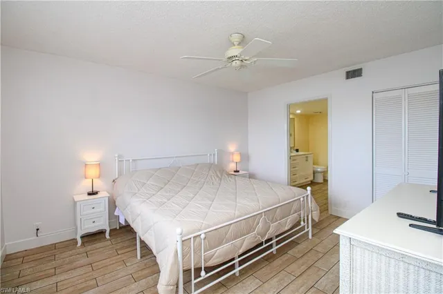 a bedroom with a bed and a table