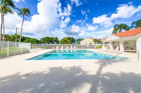 a view of swimming pool with a yard