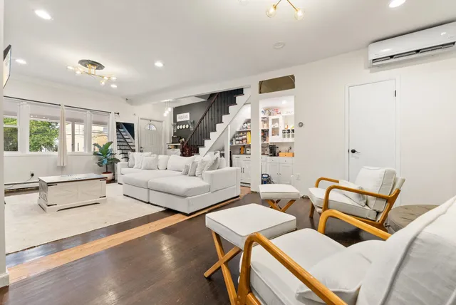a living room with furniture and a table