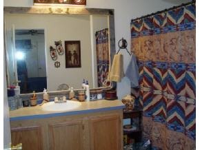 25775 North Mitchell Road, Unit 1 Paulden, AZ 86334 - Photo 5 of 11 a bathroom with a sink and a mirror