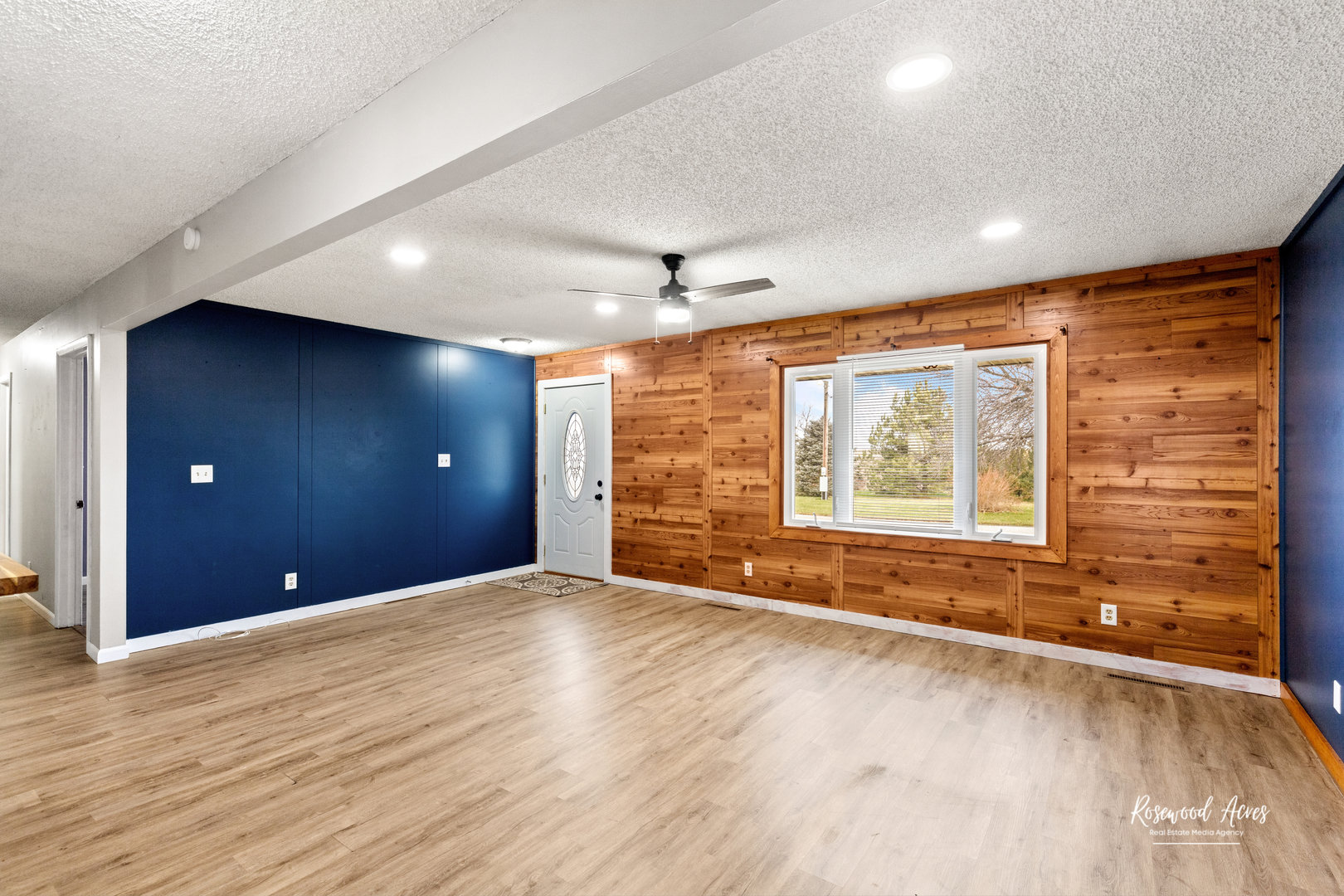 19663 North 3000 E Road Cullom, IL 60929 - Photo 4 of 18 a view of an empty room with a window and wooden floor