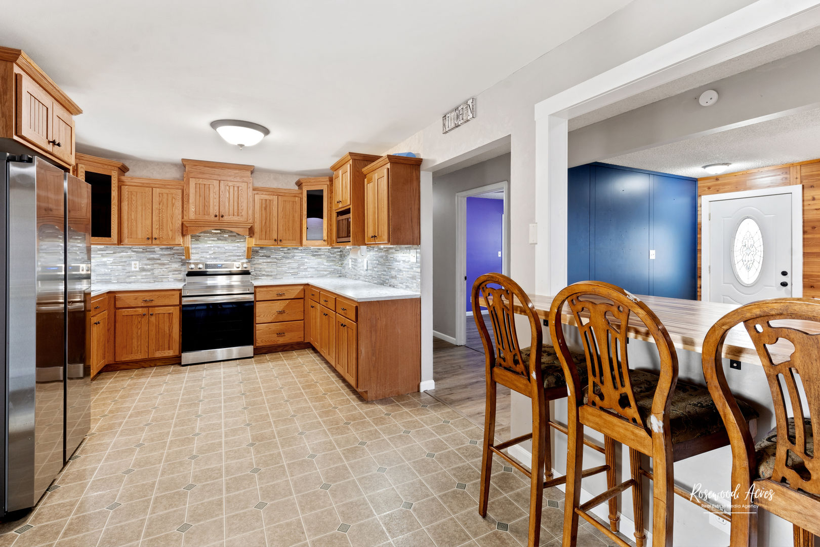 19663 North 3000 E Road Cullom, IL 60929 - Photo 5 of 18 a kitchen with stainless steel appliances granite countertop a sink a stove a dining table and chairs