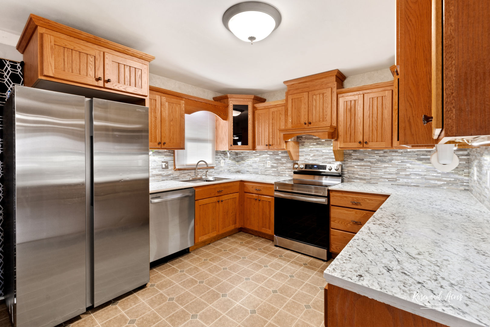19663 North 3000 E Road Cullom, IL 60929 - Photo 6 of 18 a kitchen with stainless steel appliances granite countertop a refrigerator a sink a stove with wooden cabinets