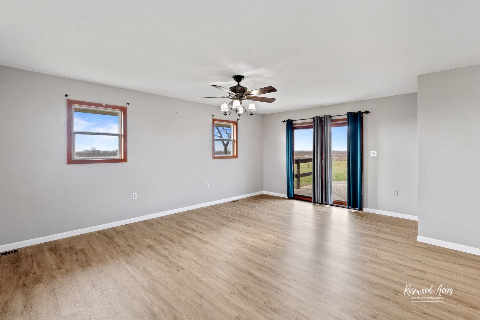 19663 North 3000 E Road Cullom, IL 60929 - Photo 7 of 18 a view of an empty room with a window and wooden floor