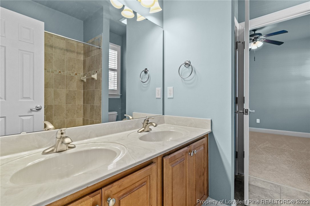 505 Falling Water Road Spring Lake, NC 28390 - Photo 20 of 40 a bathroom with a sink double vanity and a mirror