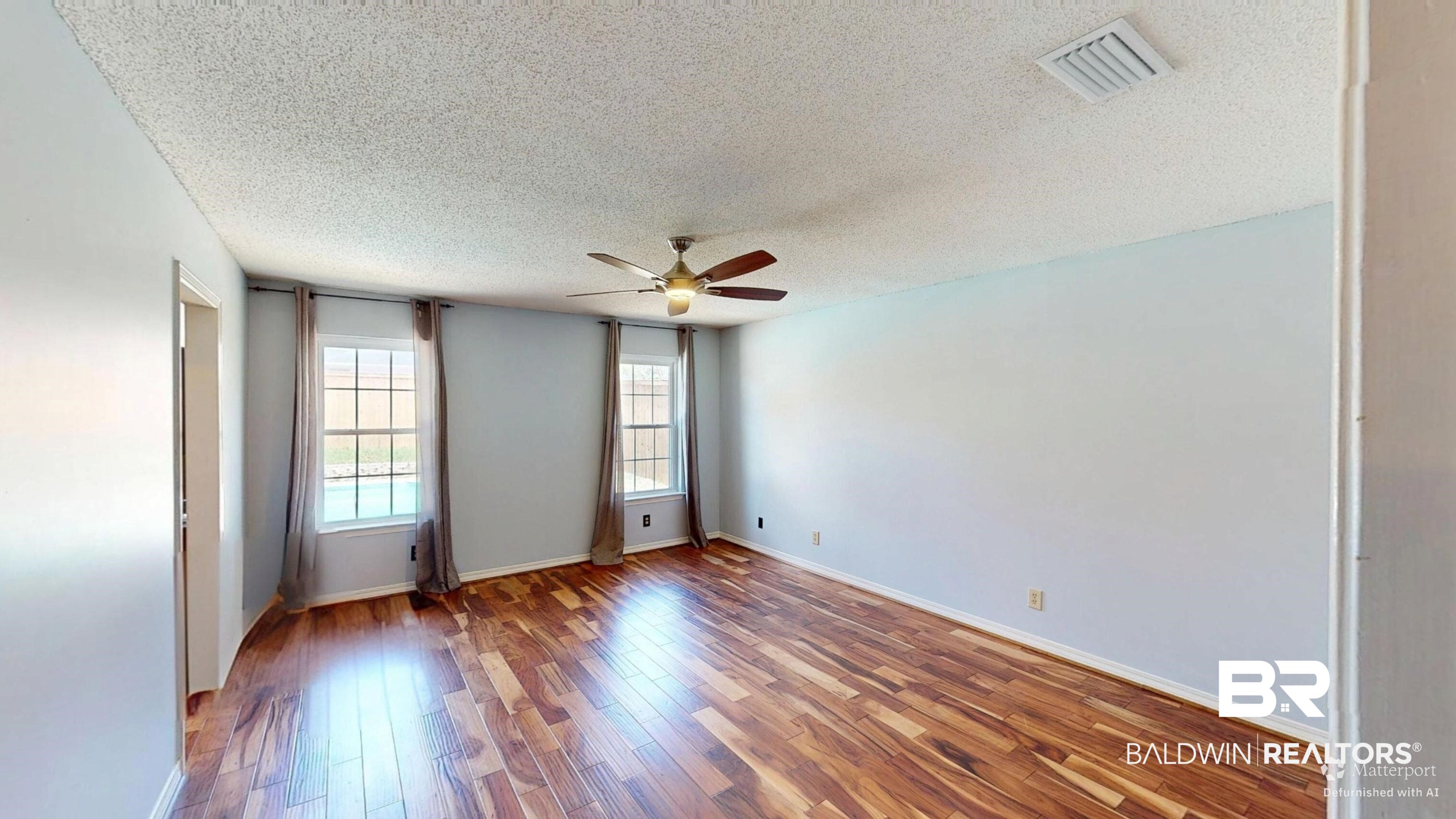 7310 Cheryl Court Mobile, AL 36695 - Photo 15 of 23 Primary bedroom has a view of the inviting pool!