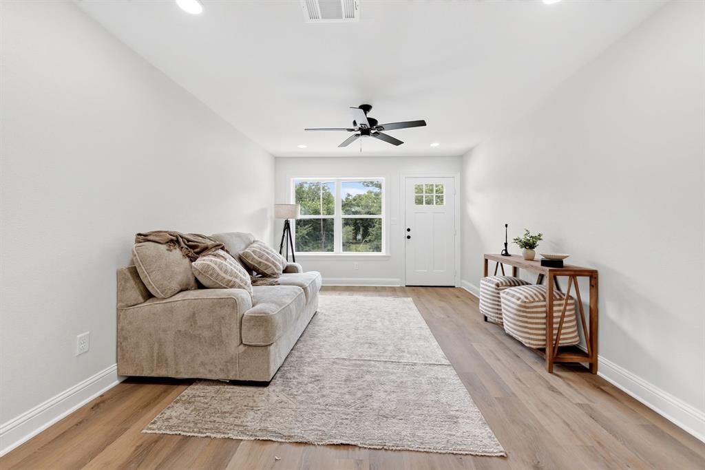 608 Bunny Rabbit Road Athens, TX 75751 - Photo 6 of 33 Living area featuring wood-finish flooring, white walls, recessed lighting, and a ceiling fan