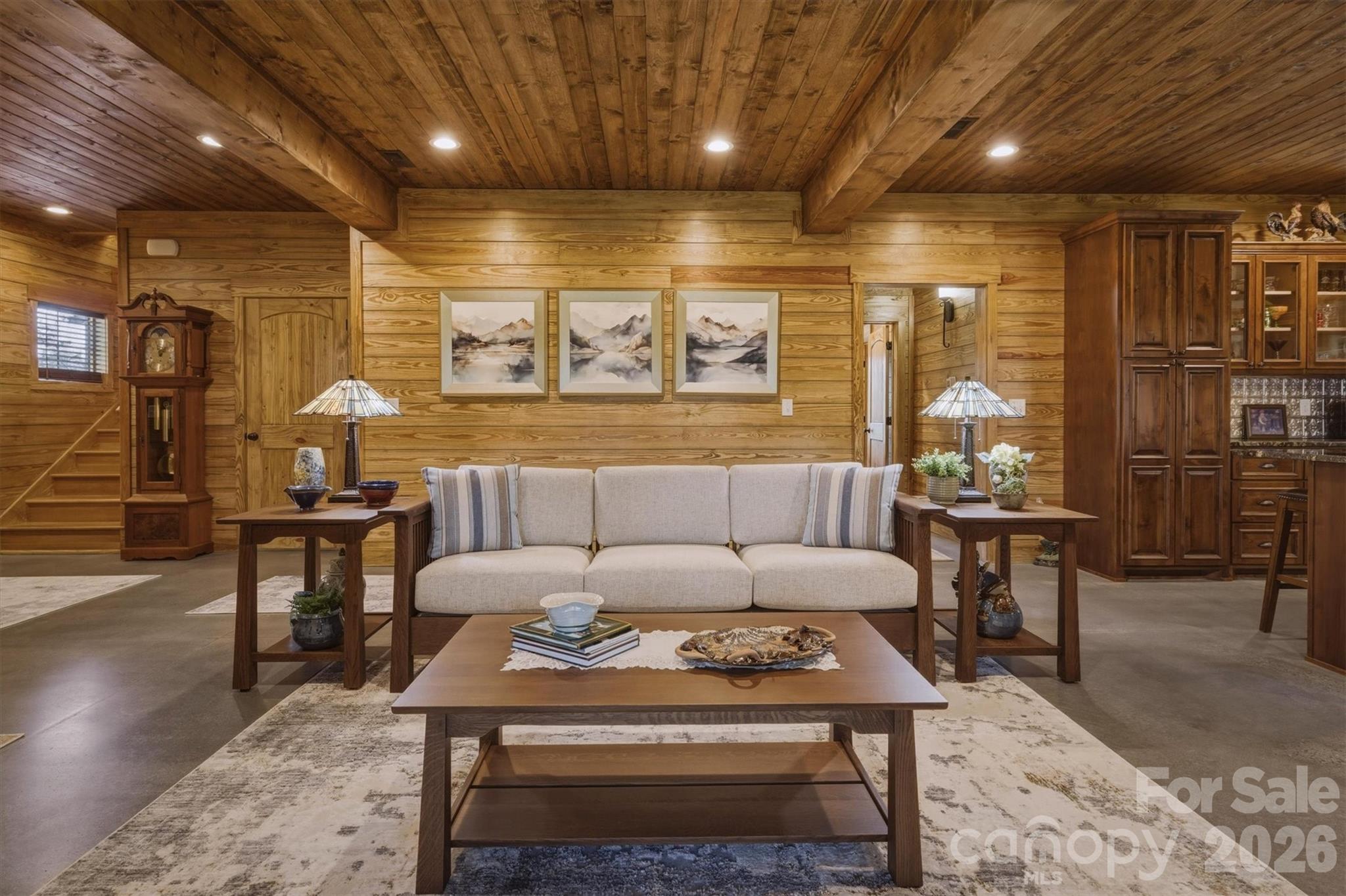 7490 Oak Ridge Church Road Connelly Springs, NC 28612 - Photo 13 of 44 a living room with furniture a wooden floor and chandelier