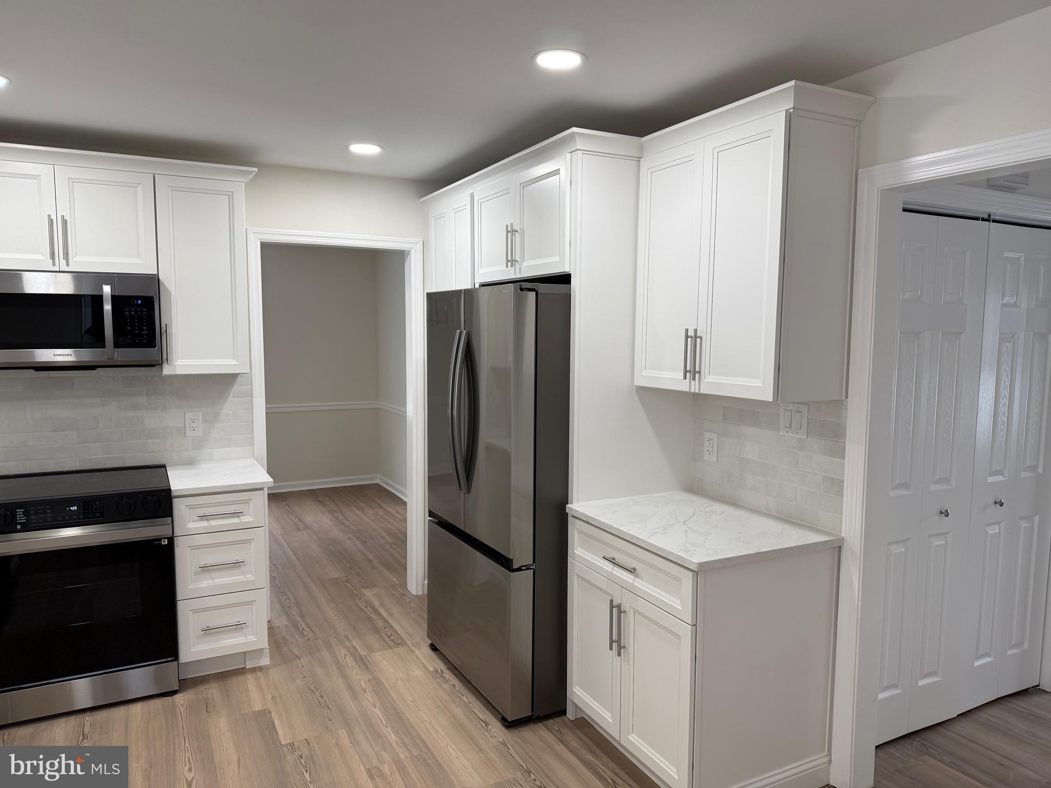 806 Lightfoot Drive Lancaster, PA 17602 - Photo 19 of 21 a kitchen with granite countertop white cabinets and stainless steel appliances