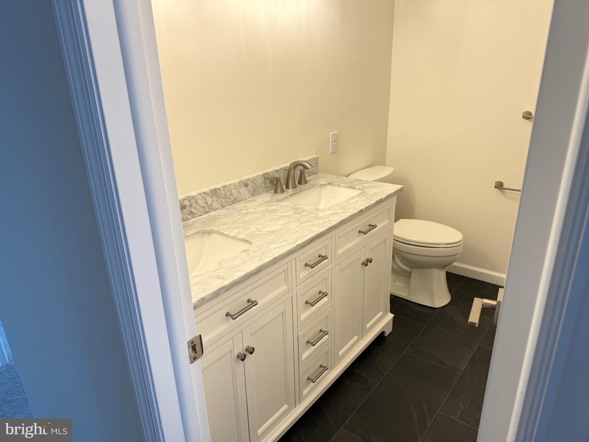 806 Lightfoot Drive Lancaster, PA 17602 - Photo 5 of 21 a bathroom with a granite countertop toilet and a sink