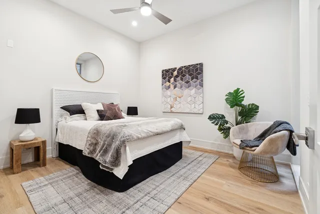 a bathroom with a double vanity sink toilet and mirror