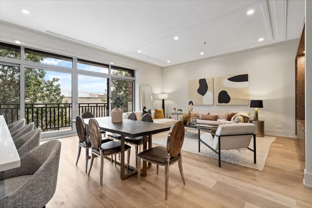 a dining room with furniture and wooden floor