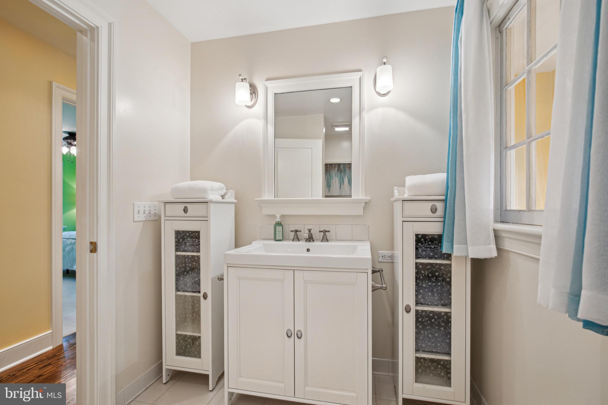 810 Macsherry Drive Arnold, MD 21012 - Photo 25 of 41 a bathroom with a sink a vanity and a mirror