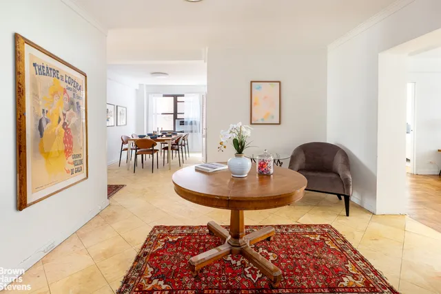 a large bed sitting in a bedroom next to a window