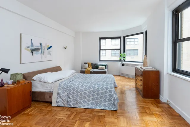 a kitchen with a sink cabinets and window