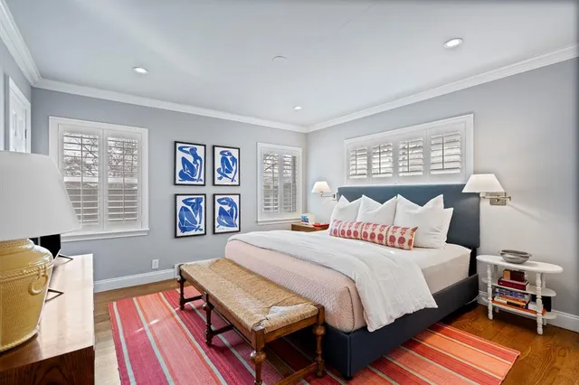 a bedroom with a bed and a book shelf