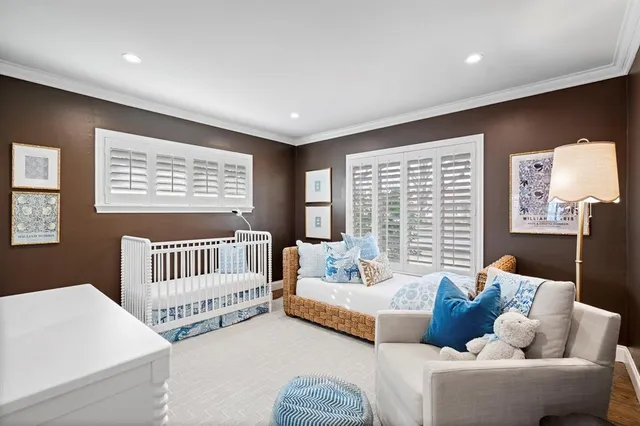 a bedroom with furniture and a window