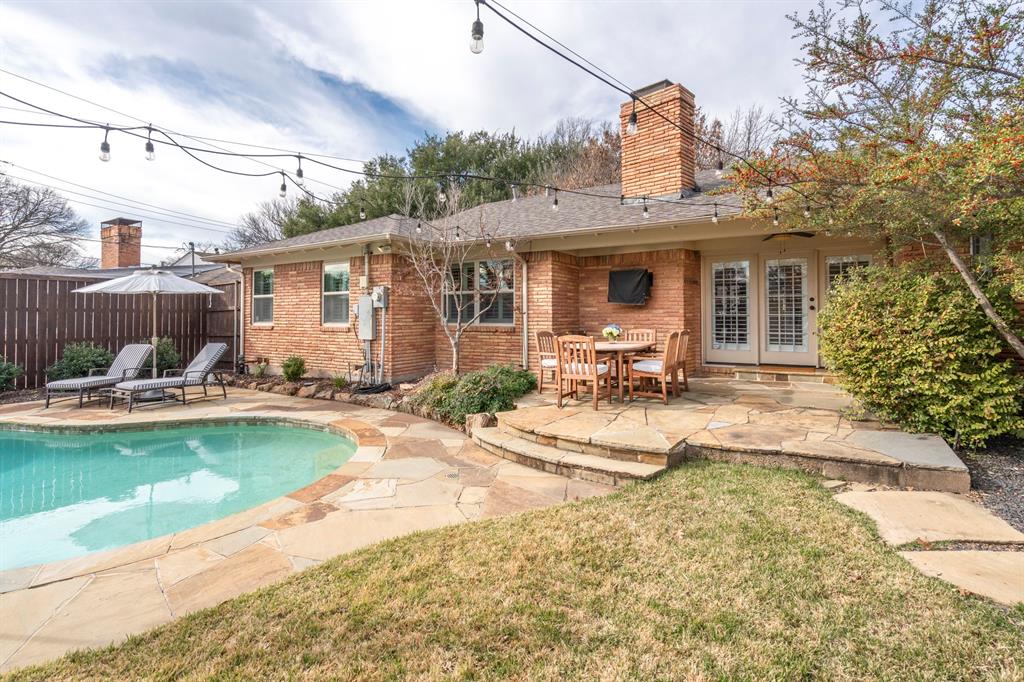 5322 Ridgelawn Drive Dallas, TX 75214 - Photo 28 of 30 a front view of a house with swimming pool garden and patio
