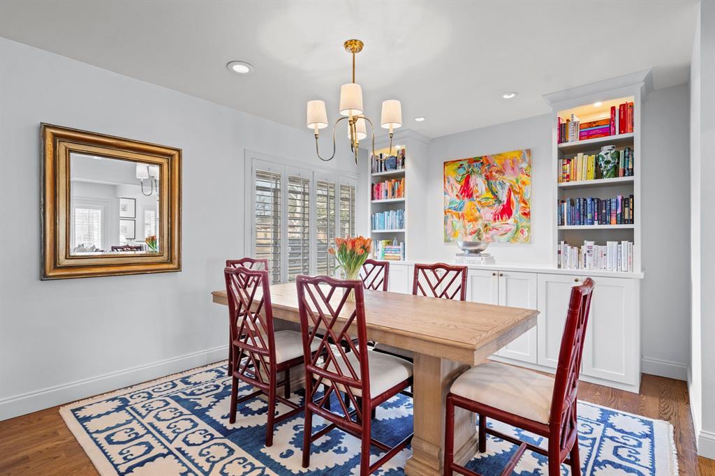 5322 Ridgelawn Drive Dallas, TX 75214 - Photo 6 of 30 a view of a dining room with furniture wooden floor and a chandelier
