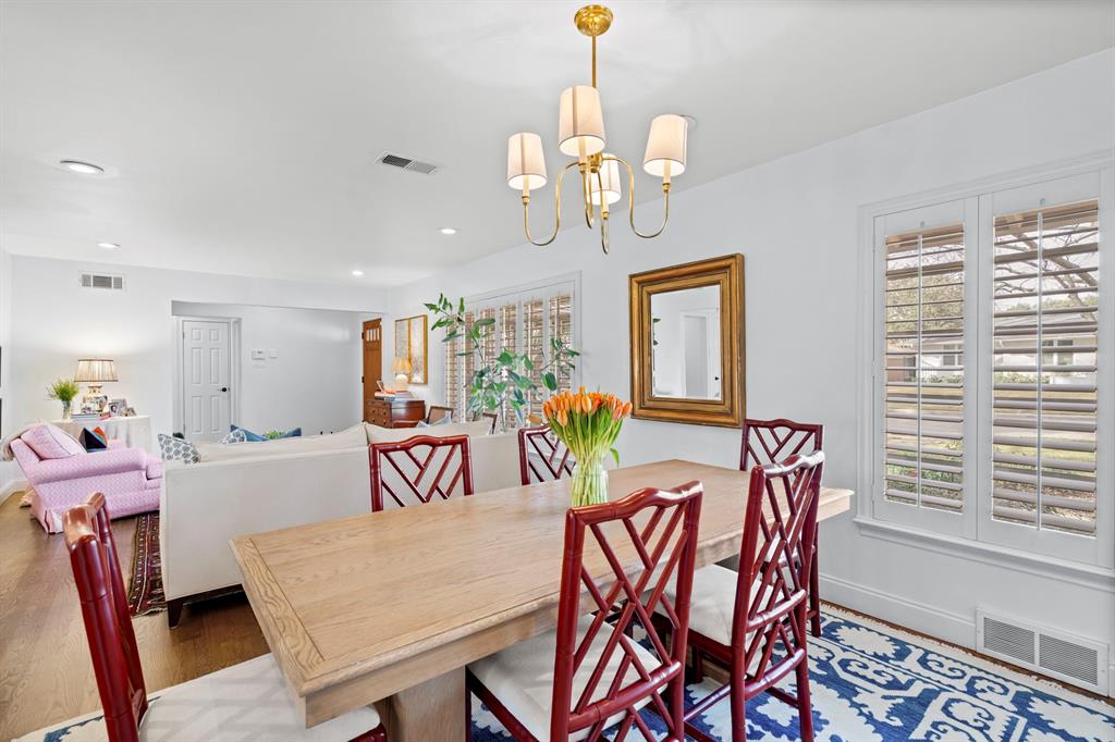 5322 Ridgelawn Drive Dallas, TX 75214 - Photo 7 of 30 a view of a dining room with furniture window and wooden floor