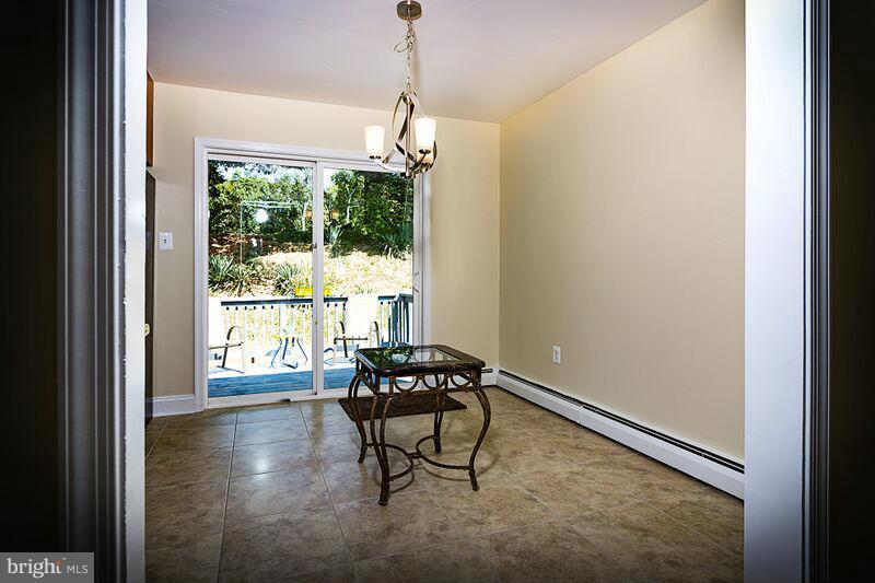 4220 Granby Road Woodbridge, VA 22193 - Photo 11 of 30 a dining room with furniture and windows