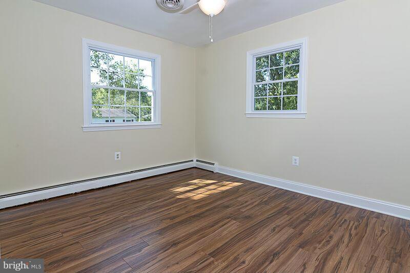 4220 Granby Road Woodbridge, VA 22193 - Photo 13 of 30 an empty room with wooden floor and windows
