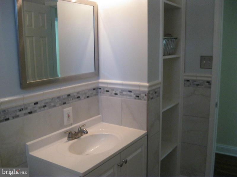 4220 Granby Road Woodbridge, VA 22193 - Photo 15 of 30 a bathroom with a sink and a mirror
