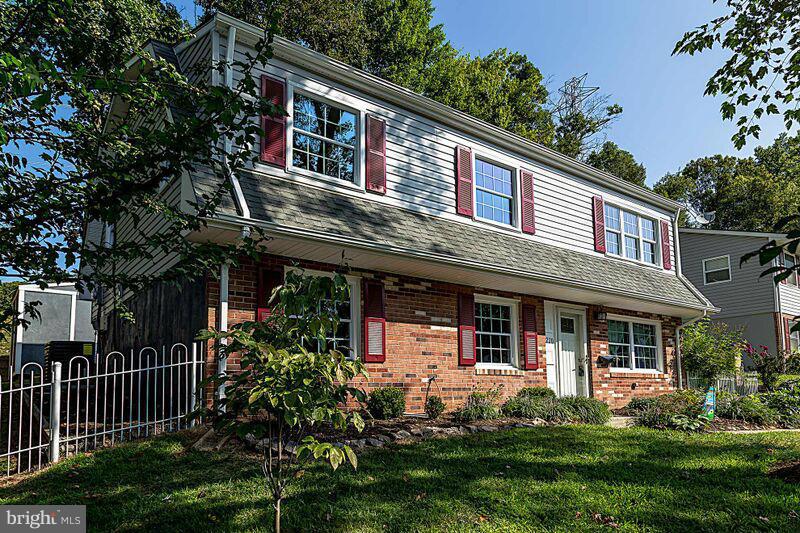 4220 Granby Road Woodbridge, VA 22193 - Photo 2 of 30 a front view of a house with a yard table and chairs