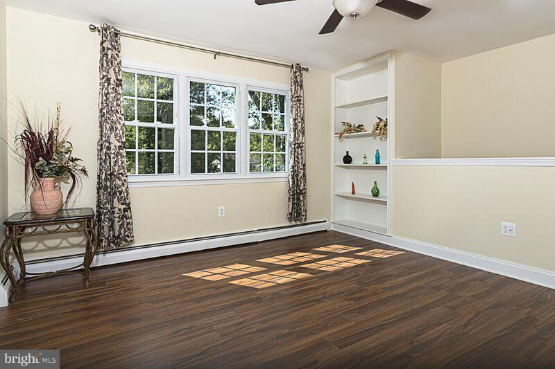 4220 Granby Road Woodbridge, VA 22193 - Photo 9 of 30 a view of an empty room with wooden floor and a window