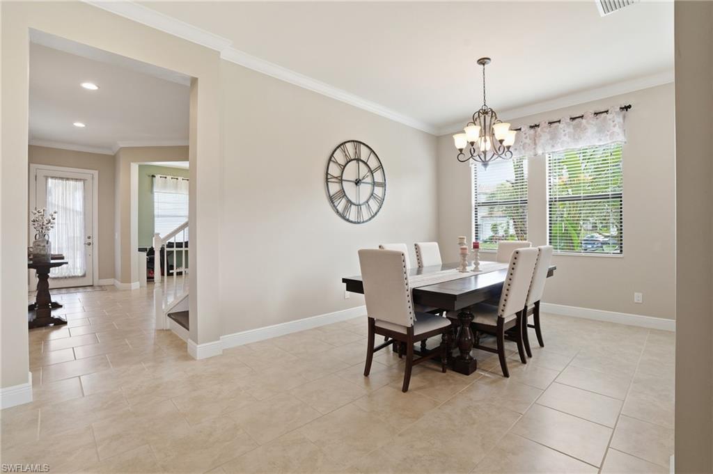 4609 Abaca Circle Naples, FL 34119 - Photo 13 of 49 a view of a dining room with furniture window and outside view