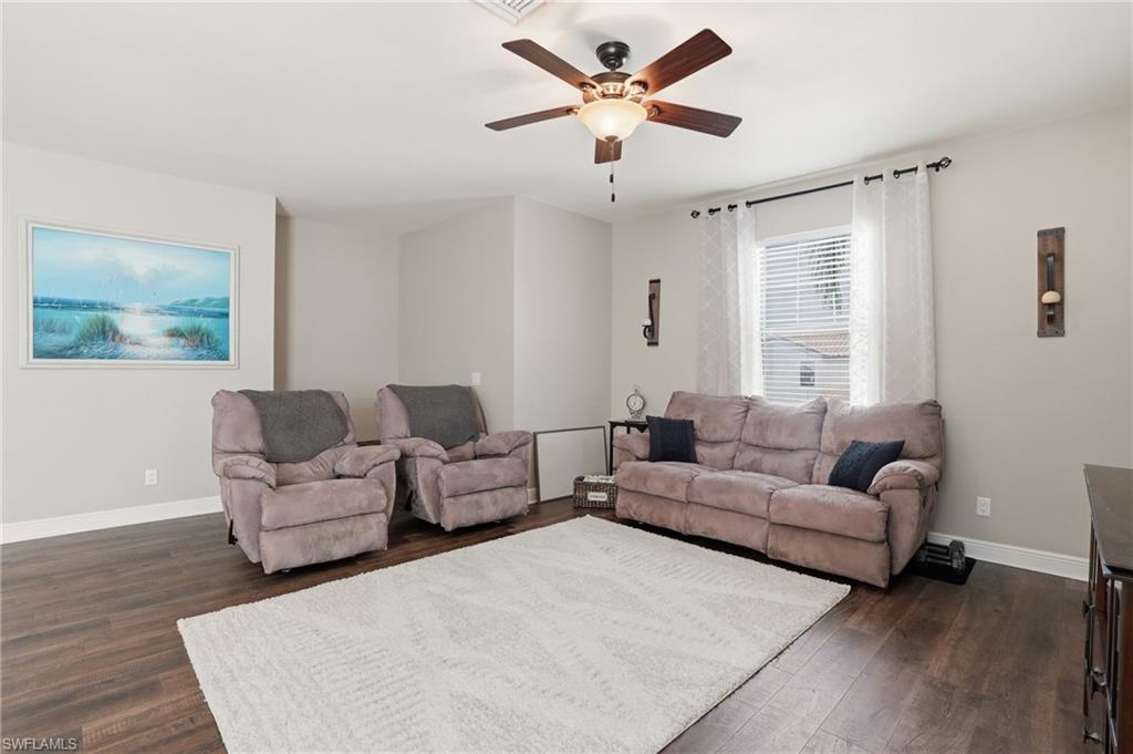 4609 Abaca Circle Naples, FL 34119 - Photo 18 of 49 a living room with furniture and a large window
