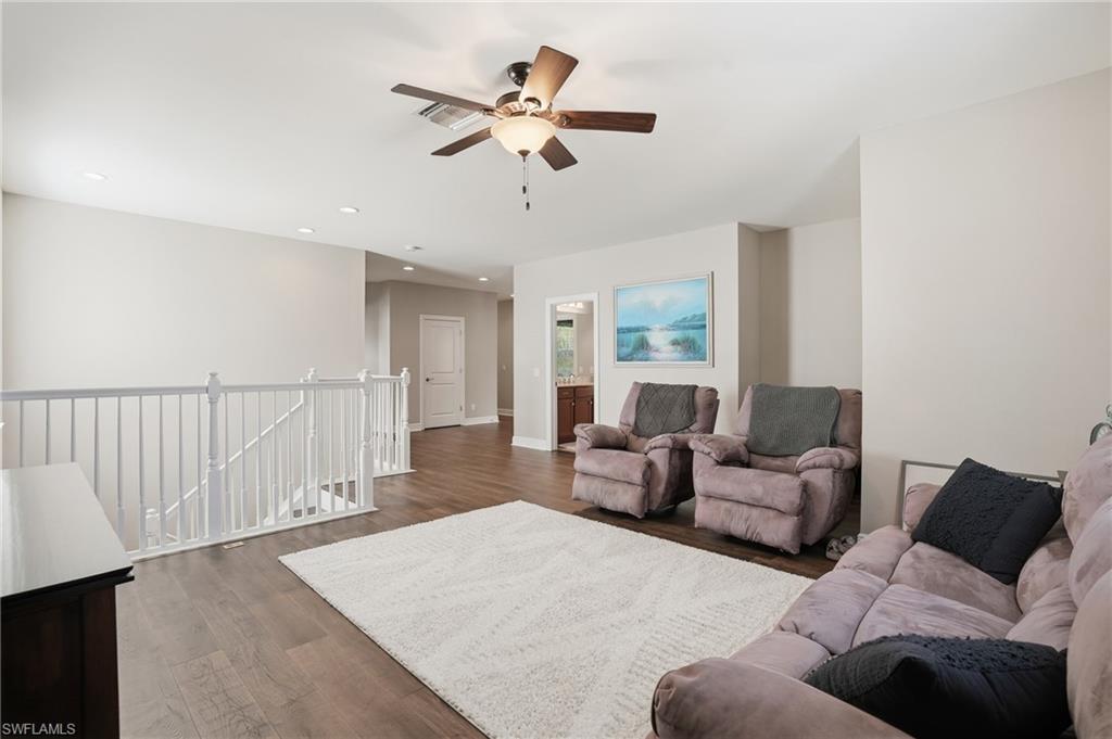 4609 Abaca Circle Naples, FL 34119 - Photo 19 of 49 a living room with furniture and a large window
