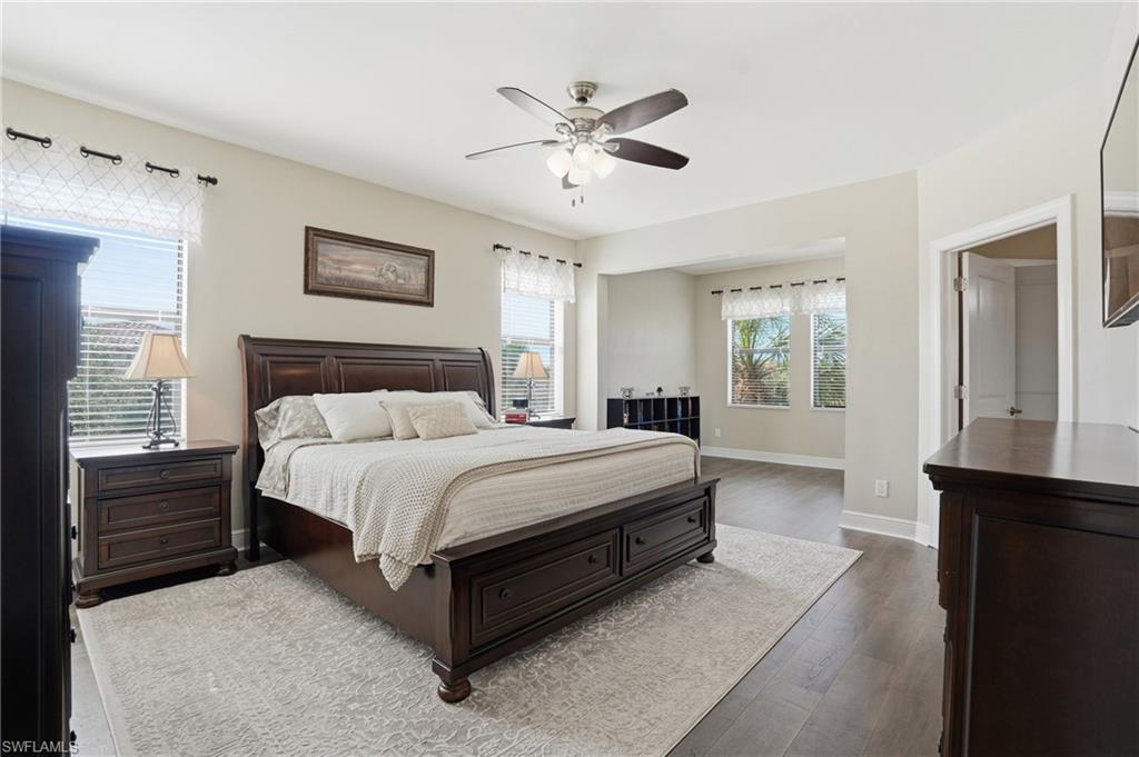 4609 Abaca Circle Naples, FL 34119 - Photo 20 of 49 a spacious bedroom with a bed and a window