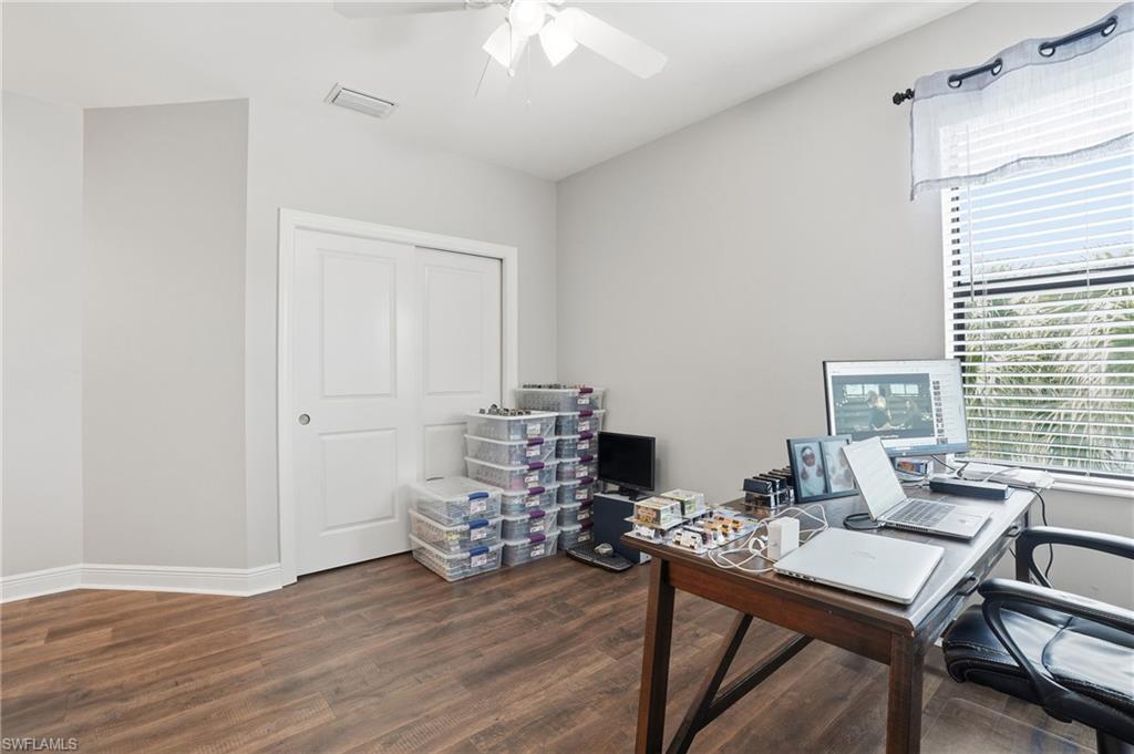 4609 Abaca Circle Naples, FL 34119 - Photo 28 of 49 a view of a workspace with furniture and a window