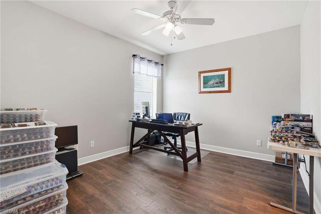 4609 Abaca Circle Naples, FL 34119 - Photo 29 of 49 a view of a workspace with furniture and a window