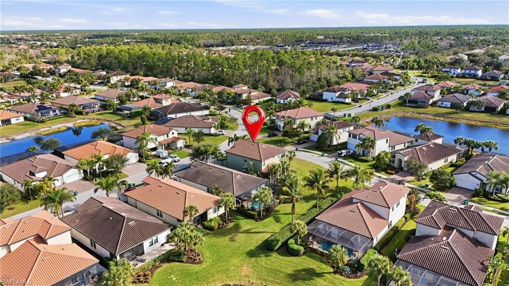4609 Abaca Circle Naples, FL 34119 - Photo 41 of 49 an aerial view of a houses with a swimming pool
