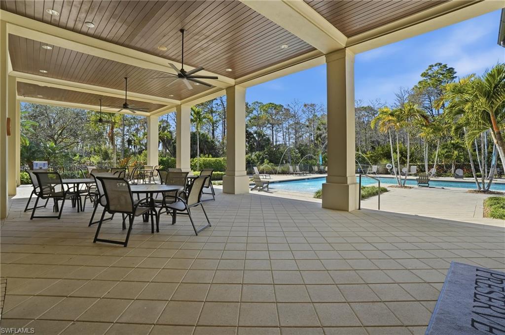 4609 Abaca Circle Naples, FL 34119 - Photo 43 of 49 a view of a patio with a table and chairs