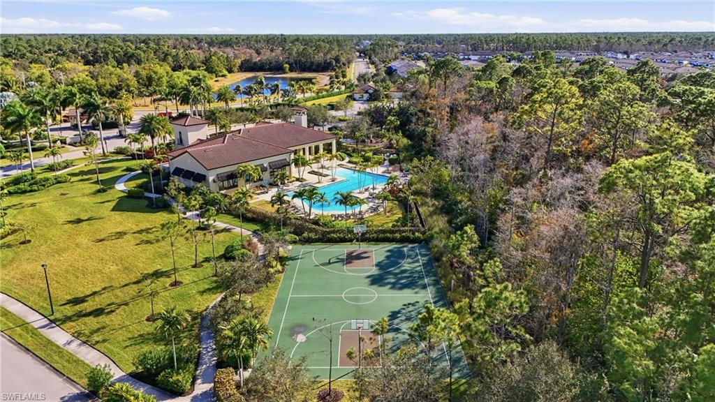 4609 Abaca Circle Naples, FL 34119 - Photo 49 of 49 an aerial view of residential houses with outdoor space and trees